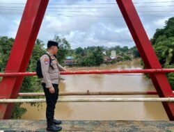 Polsek Manuhing Gencarkan Patroli Mitigasi, Pastikan Wilayah Rawan Genangan Air Terpantau