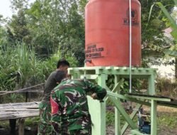 Satgas TMMD Finishing Pengecatan Tower Tandon Air Bersih